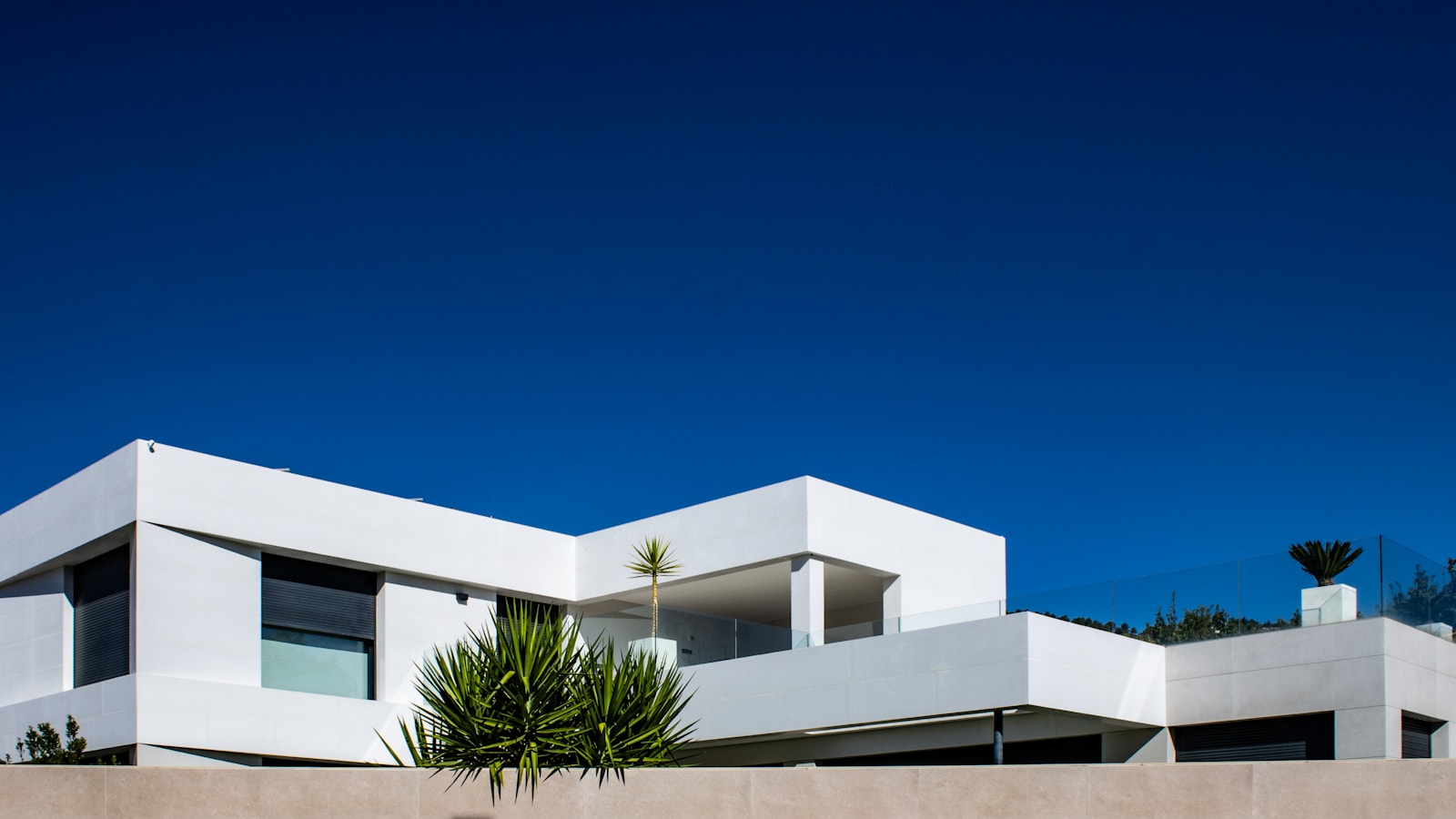 Completed modern investment property beneath a clear blue sky